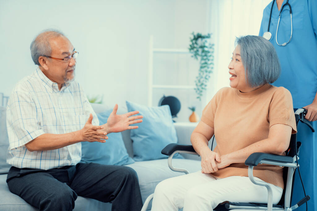 a contented senior couple and their in home nurse.