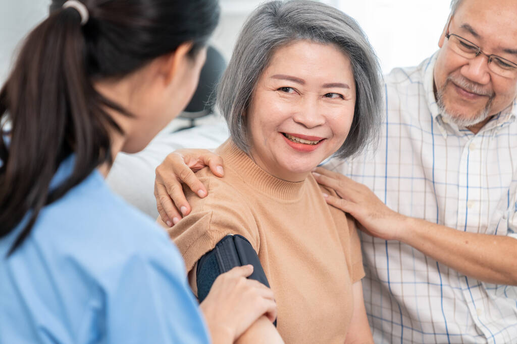 an elderly woman with a contented life having a blood pressure check.