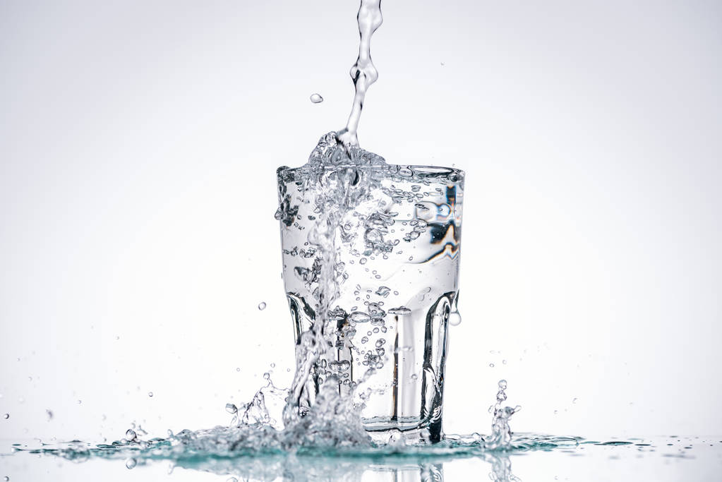 Water being poured into a clear glass