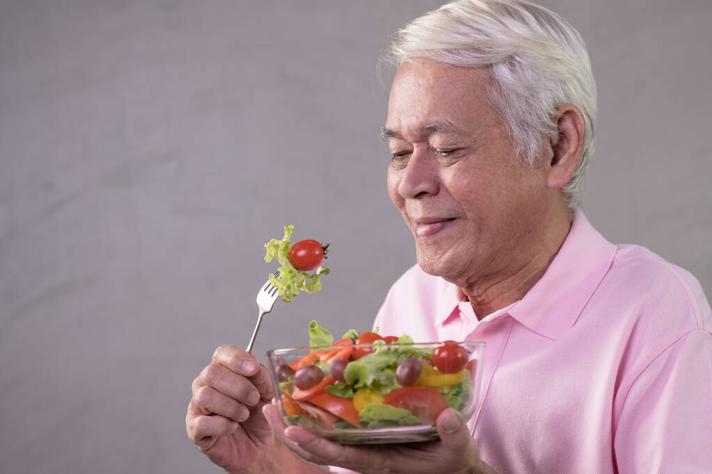Older adult enjoying a fresh salad